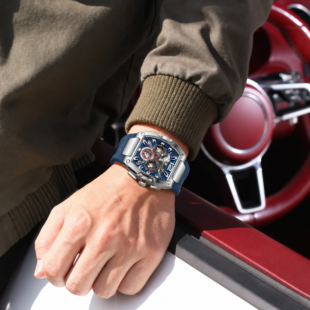 Man wearing POEDAGAR silver chronograph watch with blue dial and blue silicone strap